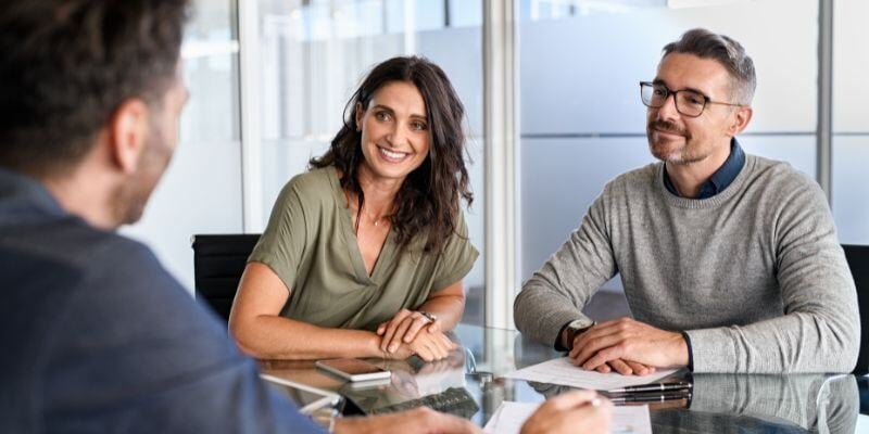 Mature couple meeting financial advisor for investment