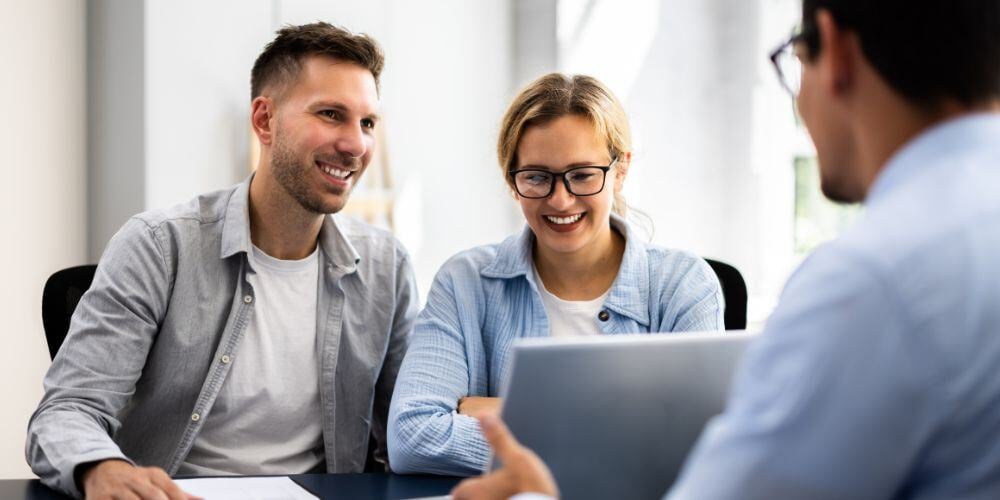 Man and woman meeting with a financial planner. 